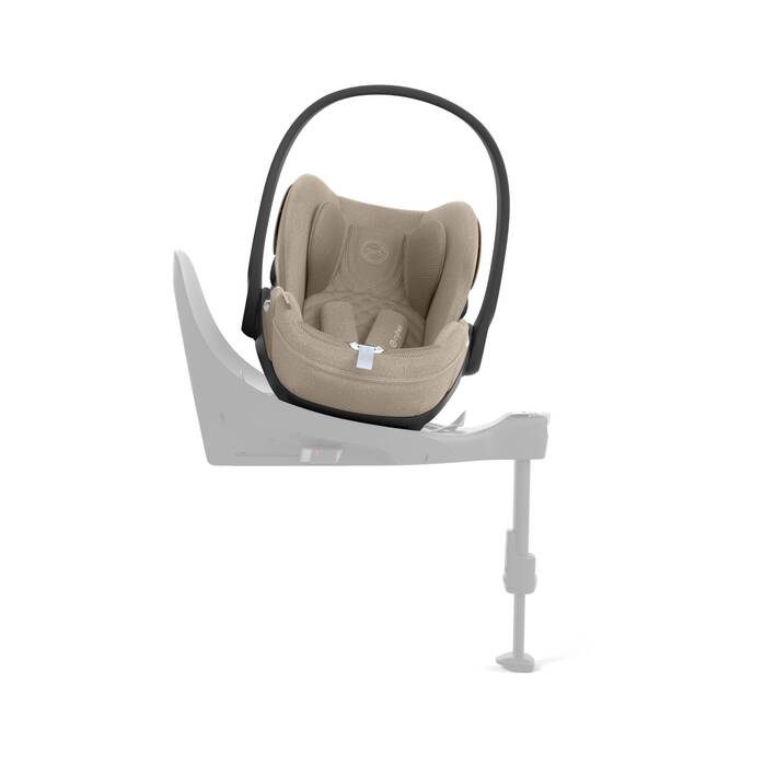 Cybex Cloud T i-Size baby-autostoel in cozy beige, getoond in liggende positie met ISOFIX basis.