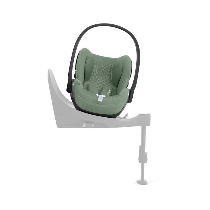 Cybex Cloud T i-Size baby-autostoel in leaf green, getoond in liggende positie met ISOFIX basis.