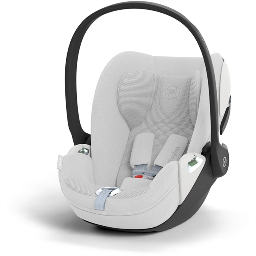 Cybex Cloud T i-Size baby-autostoel in platinum white , getoond in liggende positie met ISOFIX basis.