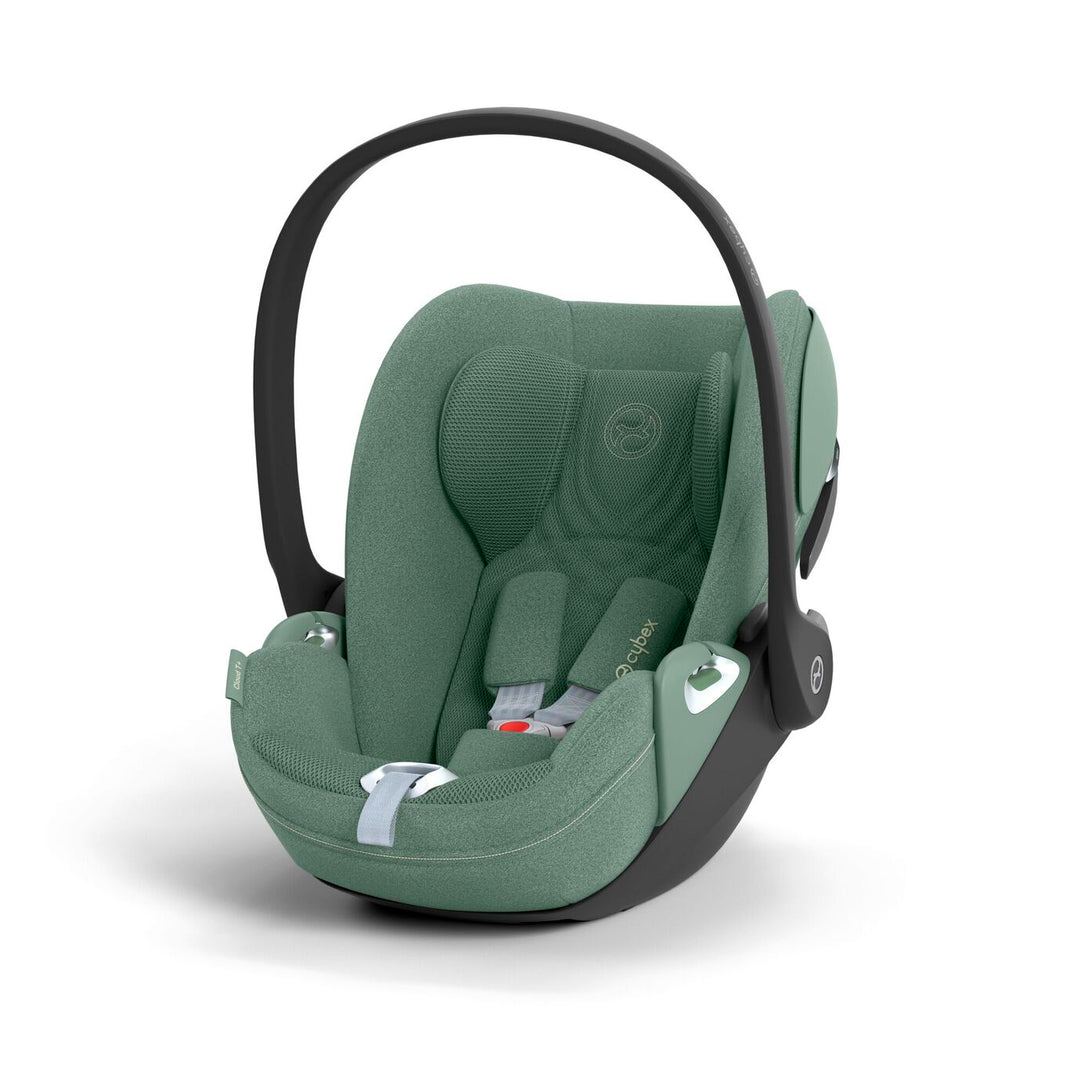 Cybex Cloud T i-Size baby-autostoel in leaf green, getoond in liggende positie met ISOFIX basis.