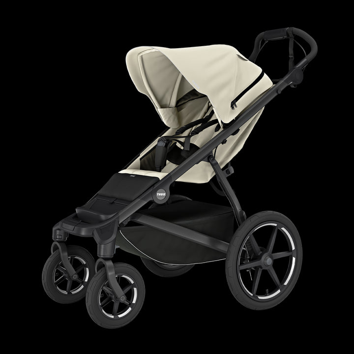 Thule Urban Glide 4-wiel buggy in beige met grote wielen en comfortabele zitje