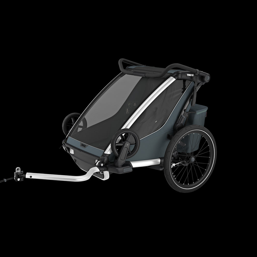 Thule Chariot Cross 2 fietskar in Dark Slate G3 tijdens het fietsen en wandelen