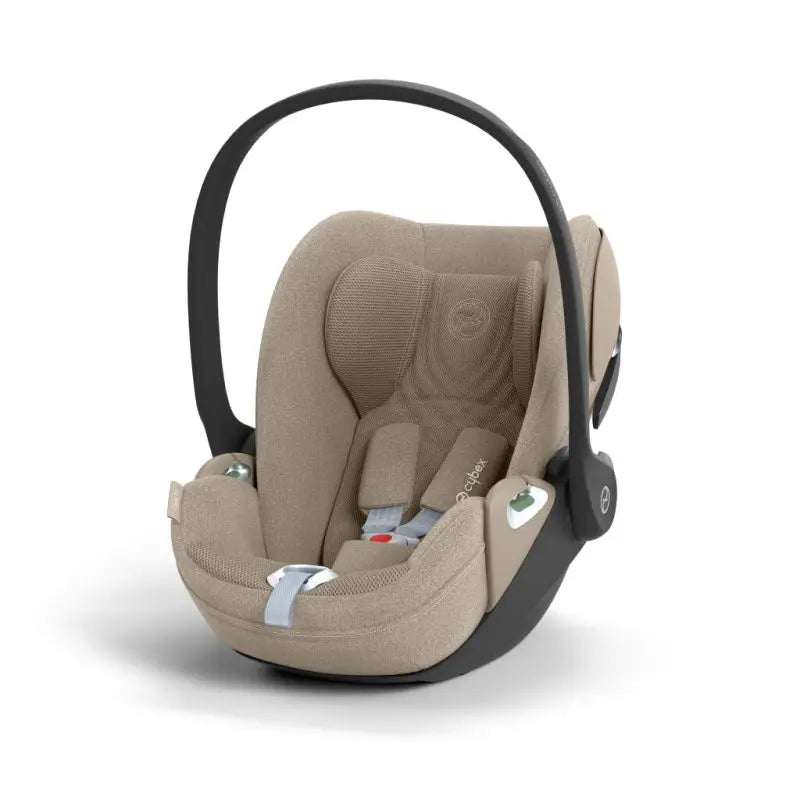 Cybex Cloud T i-Size baby-autostoel in cozy beige, getoond in liggende positie met ISOFIX basis.