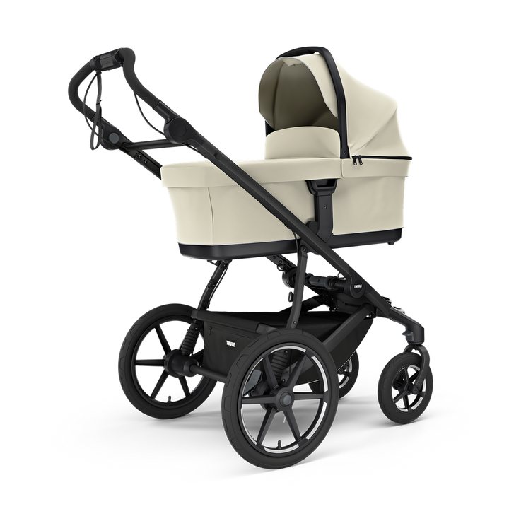 Thule Urban Glide 4-wiel buggy in beige met grote wielen en comfortabele zitje