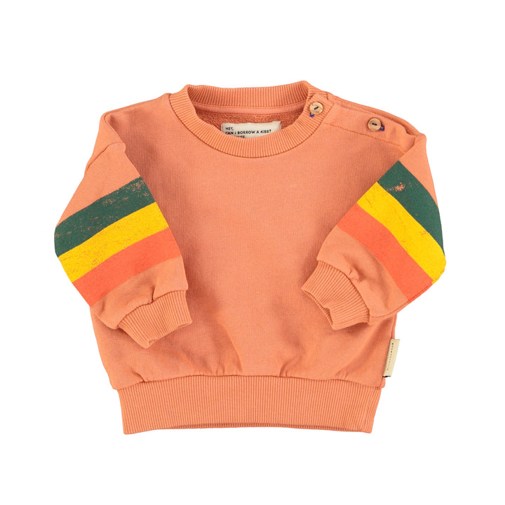 Oranjeroze baby sweater van Piupiuchick met gestreepte mouwen en ster op de achterkant