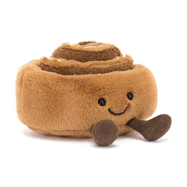 Zachte Jellycat knuffel in de vorm van een kaneelbroodje met glimlach en koordpootjes