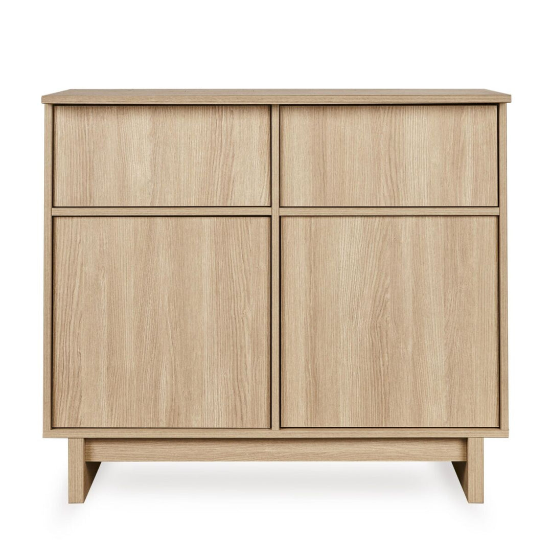 Quax Kyo commode in Honey Ash met 3 greeploze lades en houten poten