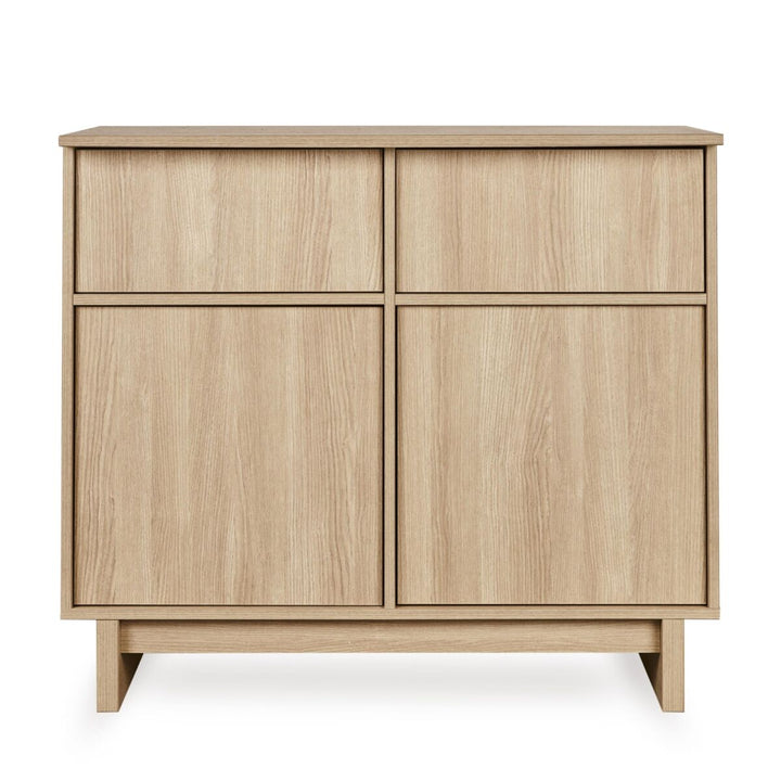 Quax Kyo commode in Honey Ash met 3 greeploze lades en houten poten