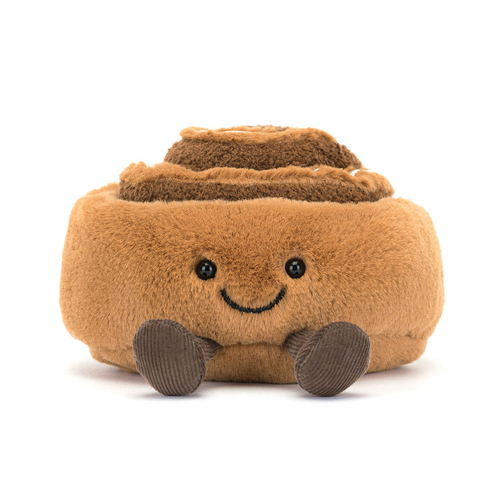 Zachte Jellycat knuffel in de vorm van een kaneelbroodje met glimlach en koordpootjes