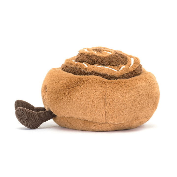 Zachte Jellycat knuffel in de vorm van een kaneelbroodje met glimlach en koordpootjes