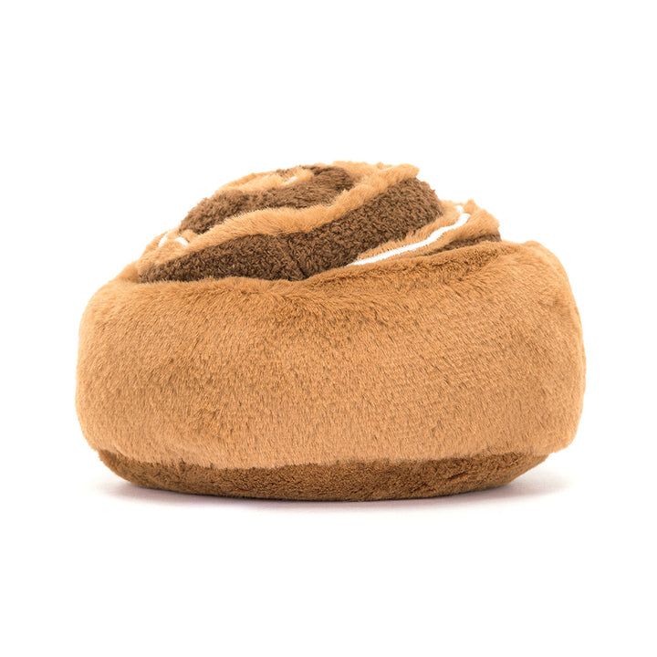 Zachte Jellycat knuffel in de vorm van een kaneelbroodje met glimlach en koordpootjes