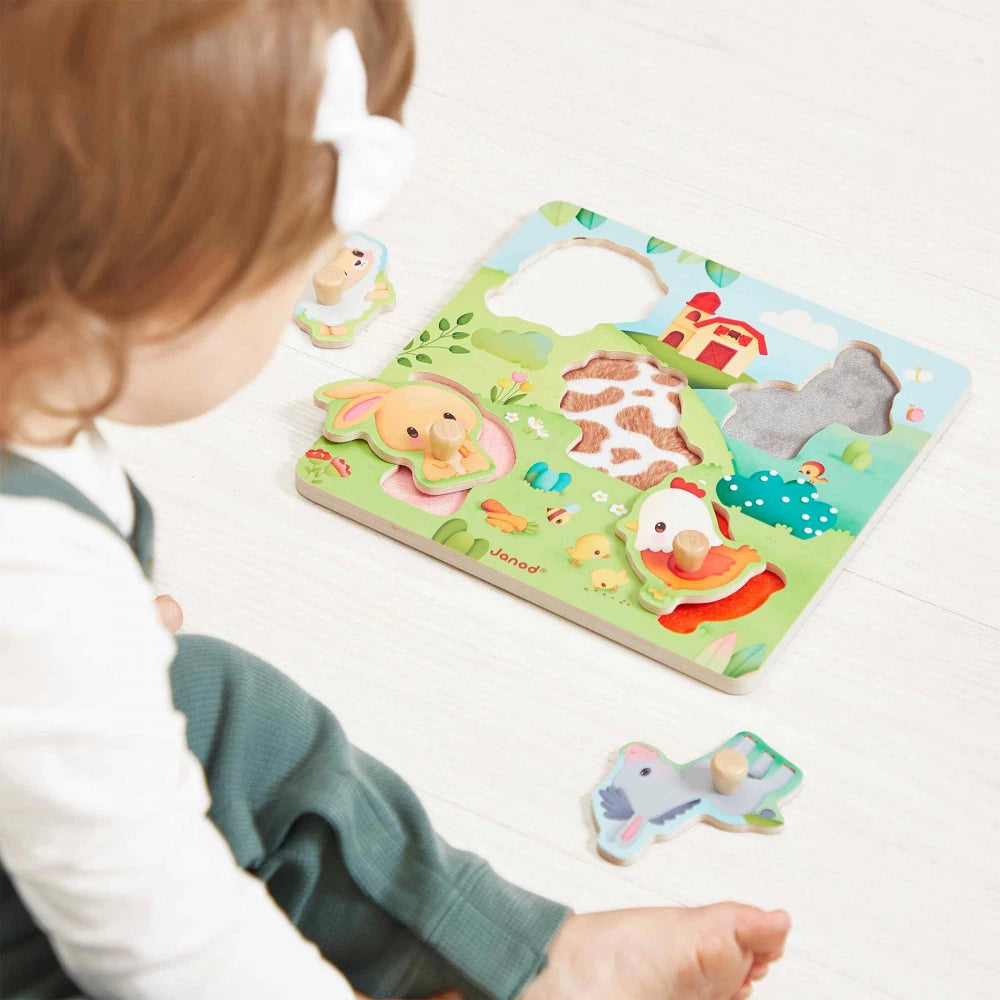 Houten Janod inlegpuzzel boerderijdieren met voeltexturen en houten knopjes