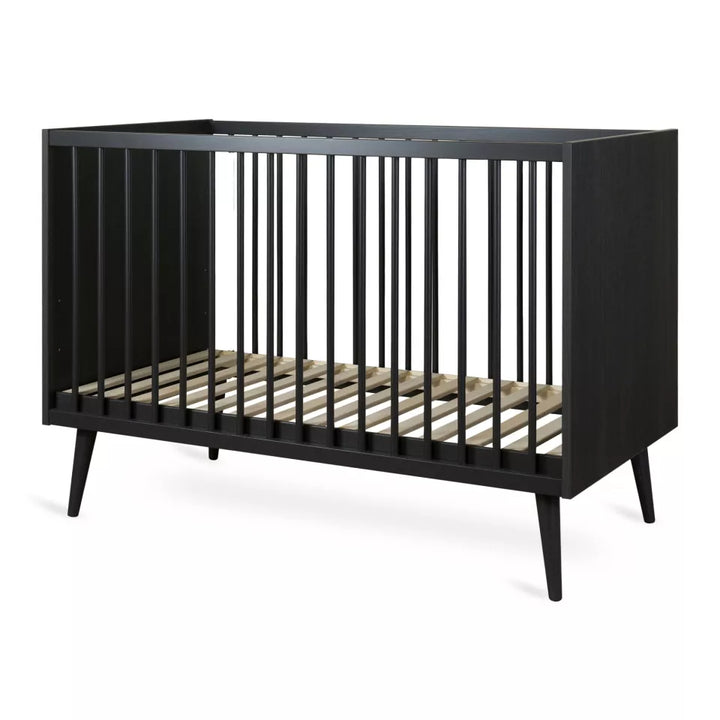 "Quax Cocoon Eboni babybed 60 x 120 cm met verstelbare bodem en elegante beukenhouten poten"