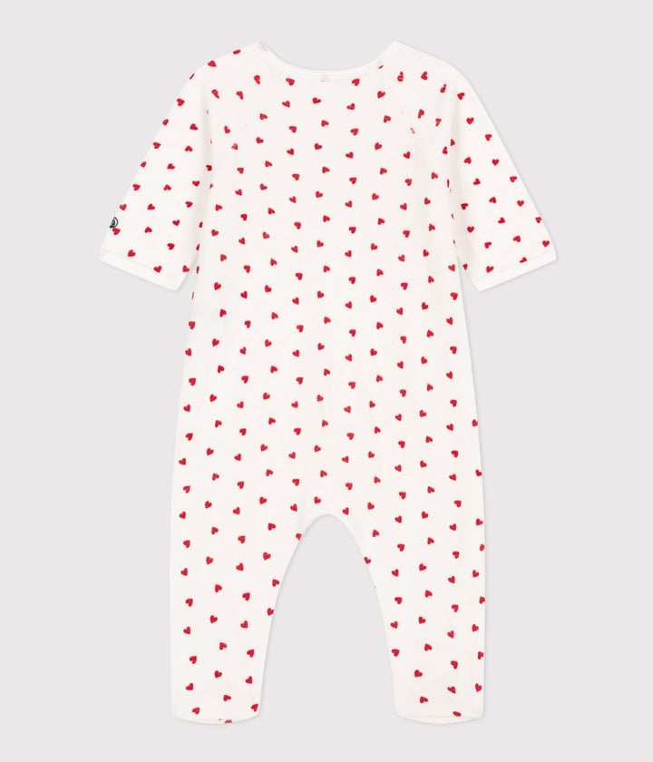 Petit Bateau baby pyjama met rode hartjes en zijsgewijze sluiting