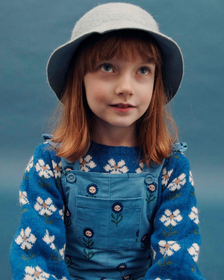 Blauwe babytrui van Emile et Ida met witte madeliefjes en ronde hals