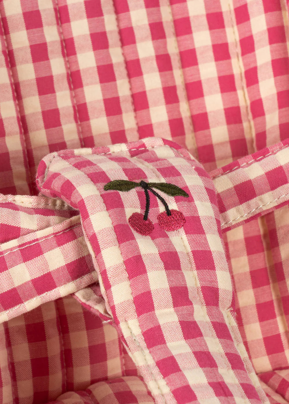 Konges Slojd poppenbuggy in roze ruitprint met EVA-handgrepen