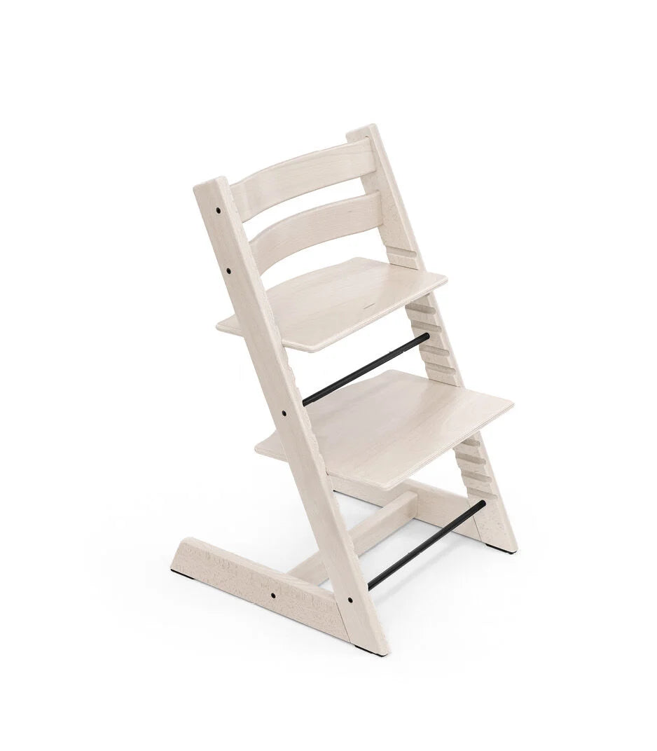 Stokke Tripp Trapp Whitewash kinderstoel in Scandinavisch design, verstelbaar en duurzaam.