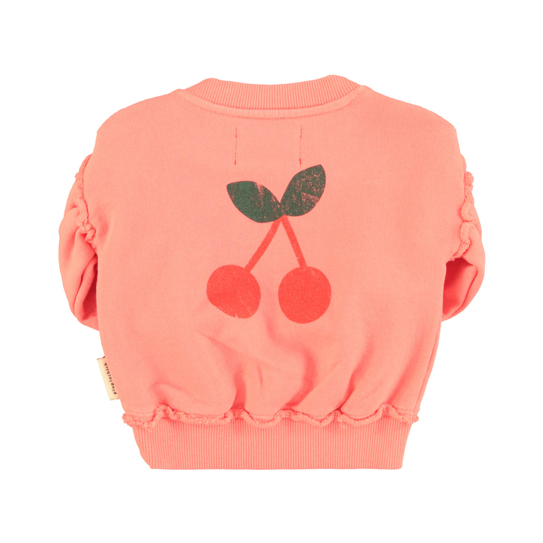 Roze baby sweater van Piupiuchick met Senior print, ruffles op de mouwen en kersenprint op de achterkant