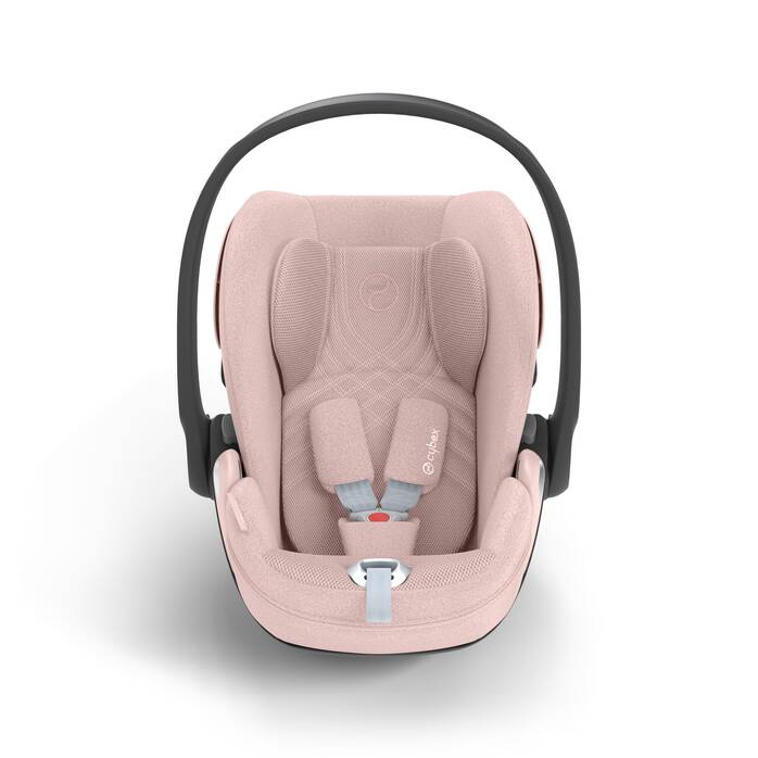 Cybex Cloud T i-Size baby-autostoel in peach pink, getoond in liggende positie met ISOFIX basis.