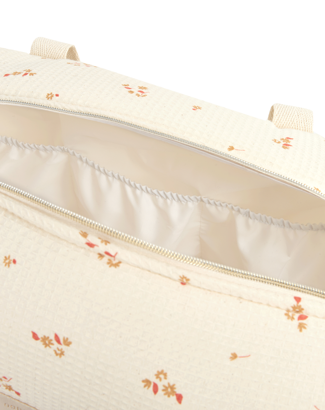 Nobodinoz verzorgingstas in gele bloemenprint met honingraatstructuur en katoenen handvaten